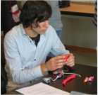 A young man building a TEI prototype